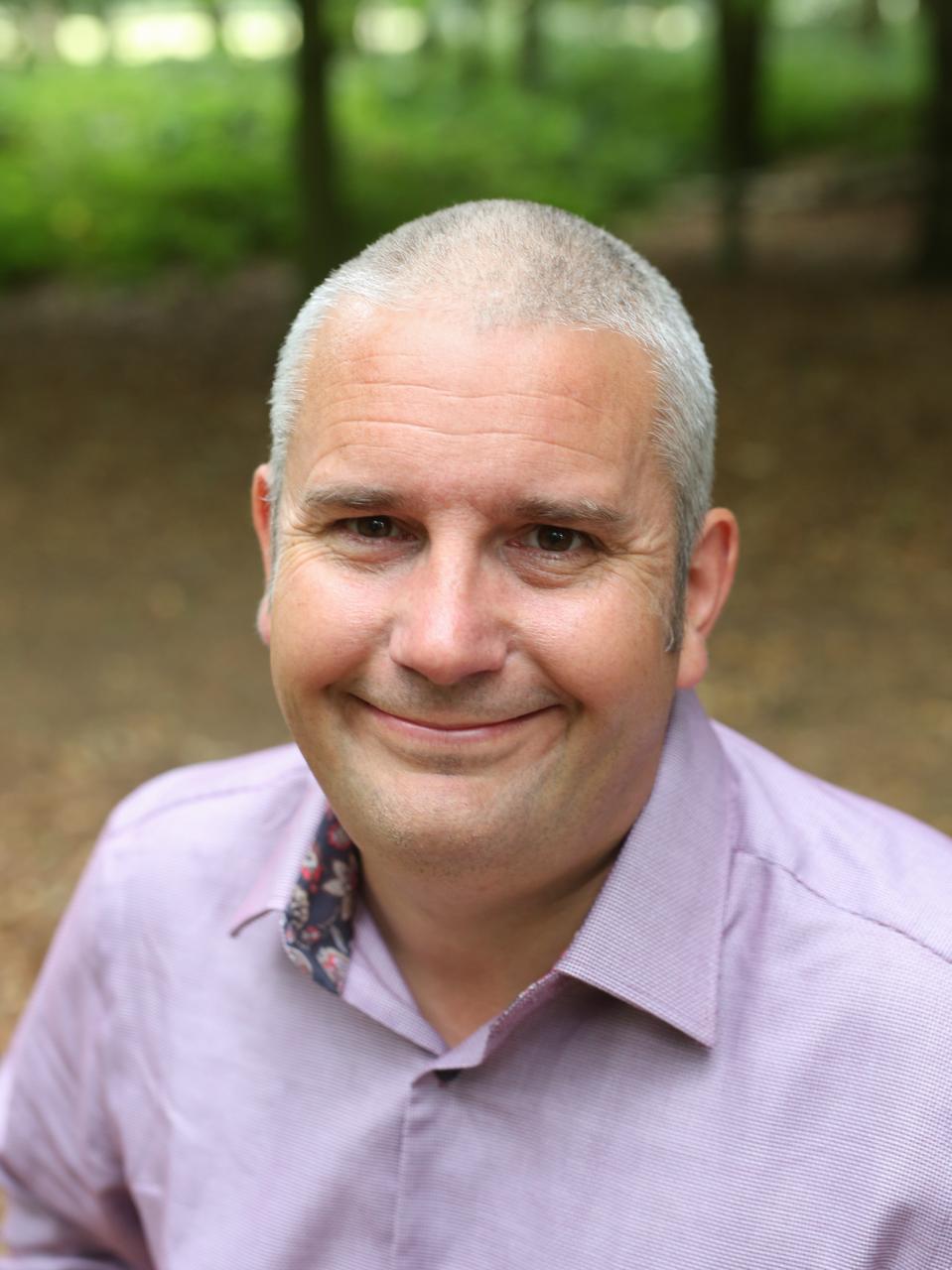 A close portrait of Brett Sheldon smiling